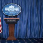 Cost-Cutting Gambit Jolts Korea Readiness White House press briefing podium with U.S. flag and blue curtain