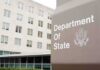 Treasury Hammer Puts Banks On Notice Department of State sign outside office building