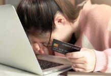 Bill Maher vs. Millennials: The $20 Test woman resting head on laptop while holding a credit card