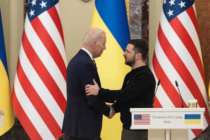 Two men shake hands at a podium with U.S. and Ukrainian flags