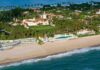 Kamala’s Malibu Move Stirs Outrage Aerial view of a beachfront estate with pool and palm trees