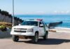 Border patrol SUV parked near beach fence