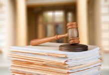 Judge Judy’s Blunt Ultimatum Stuns Critics judge's gavel resting on a stack of case files