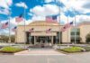 Old Clip Explodes Talarico’s Parental-Rights Pitch American flags at half-staff around a library entrance