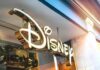 Disney store sign in gold script outside a shop