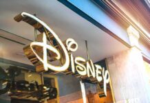 Disney store sign in gold script outside a shop
