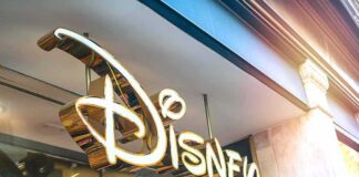Disney store sign in gold script outside a shop