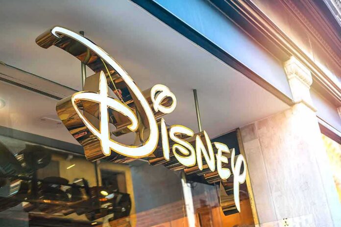 shutterstock_1258628428 Disney store sign in gold script outside a shop