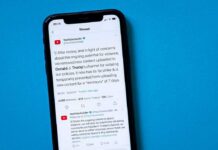smartphone displaying a social media thread on a blue background