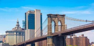 Brooklyn Bridge with ferry on the East River