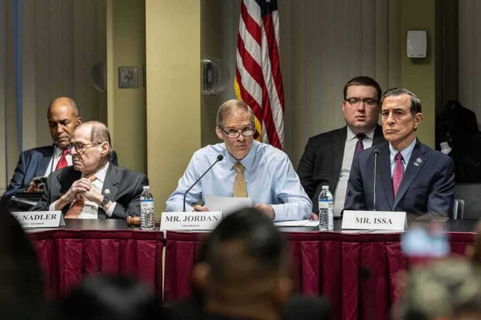 Jim Jordan speaks at a committee hearing with Jerrold Nadler and Darrell Issa seated beside him