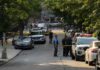 Home Invasion Horror: Wife Hears “Elijah” Police officers secure a residential street with patrol cars and yellow tape