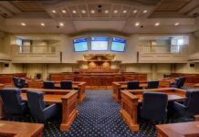 Congress Explodes Over ‘Men Can Get Pregnant’ Claim Courtroom interior with wooden benches and judge's bench
