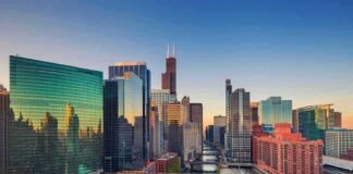 Chicago skyline along the river at sunset