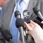Pentagon Locks Out Press—Classified Zone Microphones held toward a person in a suit