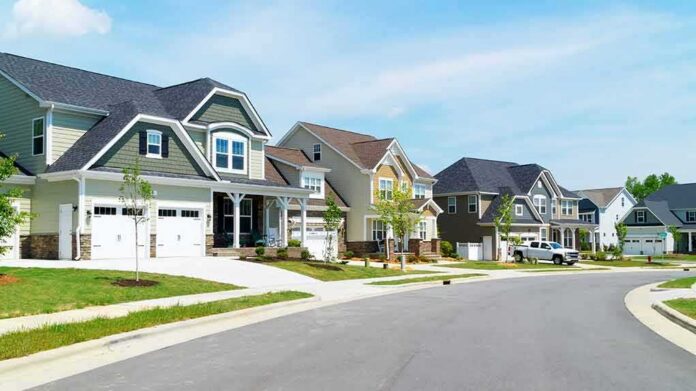 shutterstock_629472962 Suburban street with modern two-story houses