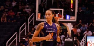 Brittney Griner running on a basketball court during a game