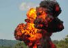 Night Sky Ablaze – Mystery Cause Still Looms Fireball explosion with thick black smoke in open landscape