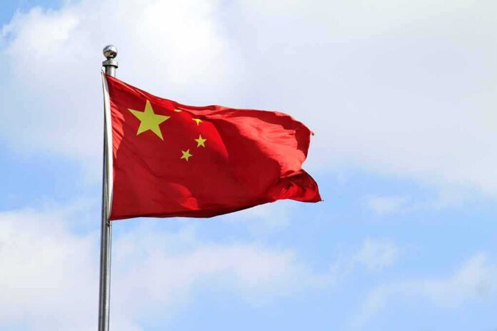 Chinese national flag waving on a flagpole
