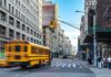 School Bus Horror In Florida City street with yellow school bus passing under traffic light