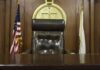 judge's chair in a wooden courtroom