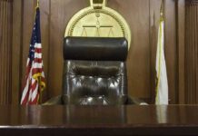 judge's chair in a wooden courtroom