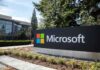 Green Card Pipeline SHUT For Microsoft Microsoft sign outside a modern office campus