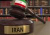 Judge's gavel with Iran label in law library