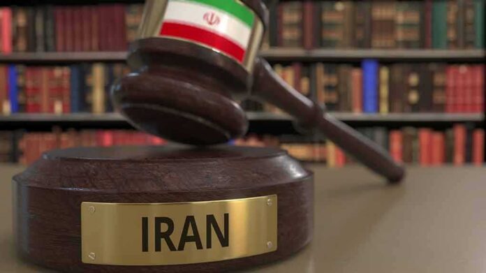 Judge's gavel with Iran label in law library