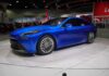Blue sedan on display at an auto show
