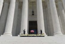 Ex-Speaker Dies – Legacy Upended Flag-draped casket on courthouse steps between towering columns