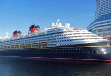 Cruise ship docked at a modern harbor terminal