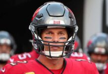 Brady Erupts: ‘No Way!’ Flag Flips Game football player in helmet and red jersey looking forward