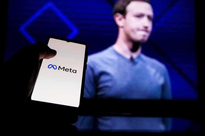 Mark Zuckerberg on screen with a hand holding a phone showing the Meta logo