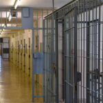 Death Row Drama: No Pronouncement, Just Sirens Prison corridor with barred doors
