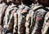 Soldiers in camouflage uniforms standing in formation