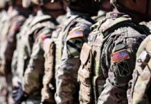 Soldiers in camouflage uniforms standing in formation
