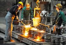 Dontrelle Inman and coworkers pour molten metal into molds at a foundry