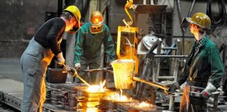 Dontrelle Inman and coworkers pour molten metal into molds at a foundry