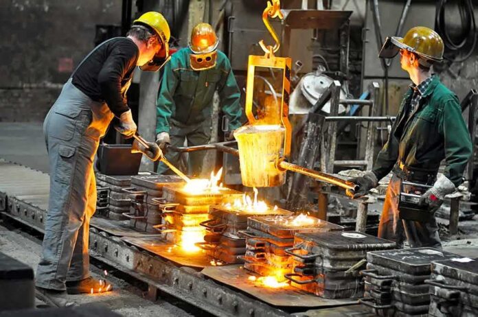 Dontrelle Inman and coworkers pour molten metal into molds at a foundry